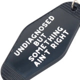 Something Ain't Right Hot Stamped Motel Keychain