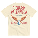 Cream colored Comfort Colors shirt with vintage-style text that reads 'Richard Valenzuela and his Flying Guitar' with an image of a blue guitar and orange wings from Sew Bonita in Corpus Christi, Texas