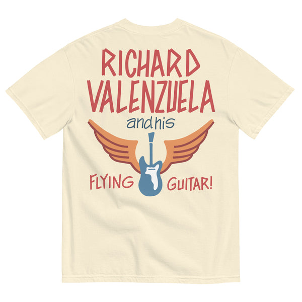 Cream colored Comfort Colors shirt with vintage-style text that reads 'Richard Valenzuela and his Flying Guitar' with an image of a blue guitar and orange wings from Sew Bonita in Corpus Christi, Texas