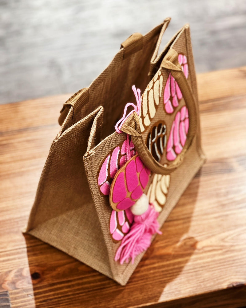 natural Burlap tote bag with hand painted conchas sew bonita side top view